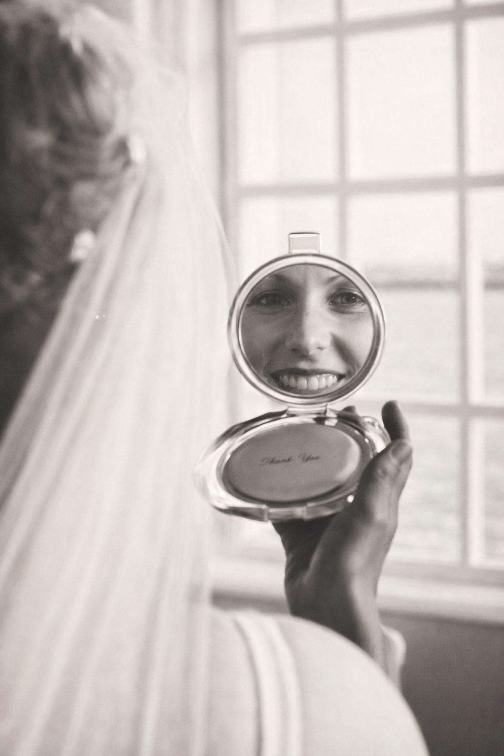 Gina on her wedding day looking in the mirror